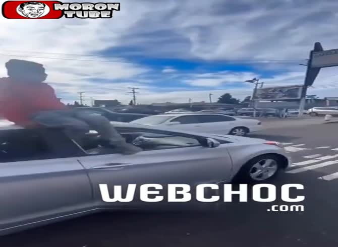 Video :He puts on a show sitting on the roof of a car, and falls hard onto the road